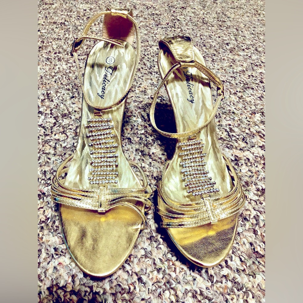 8 woman’s gold high heels with diamonds in front,back of heals and around souls.